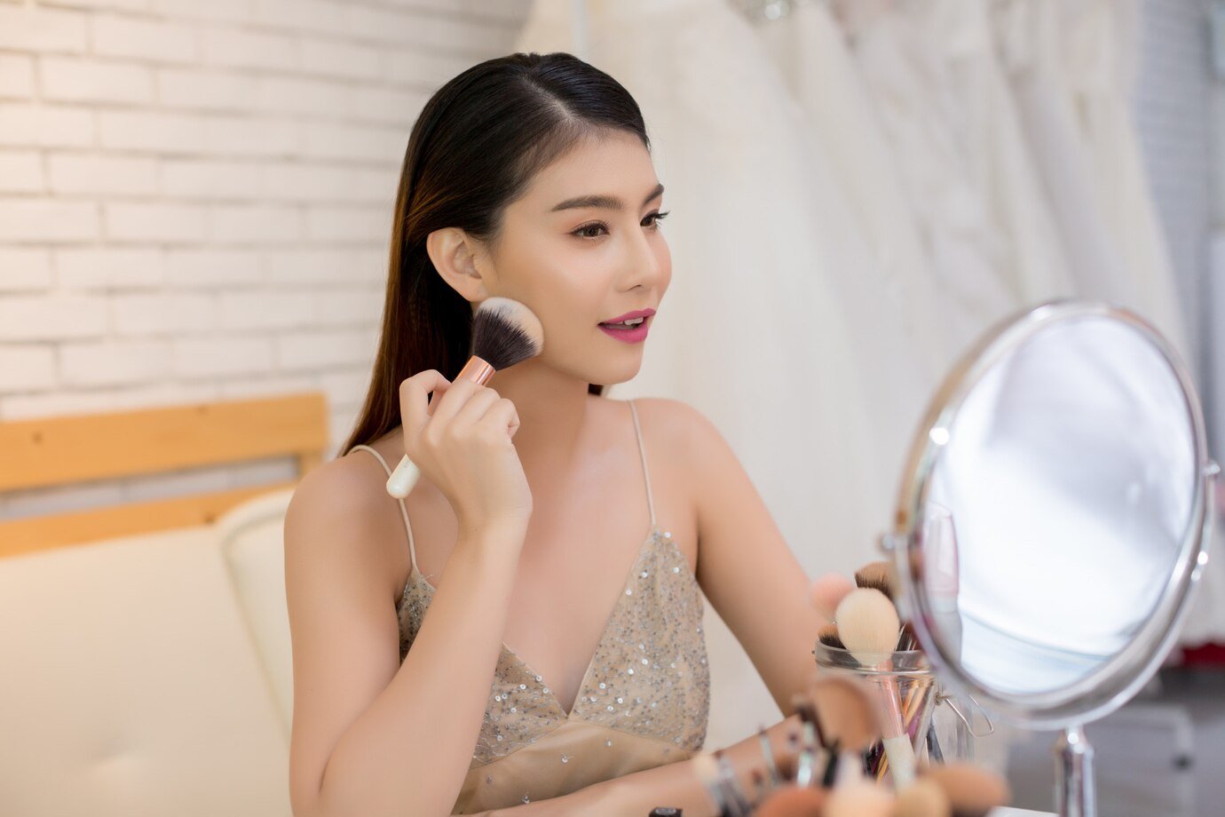beautiful-woman-face-hand-make-up_1150-11296